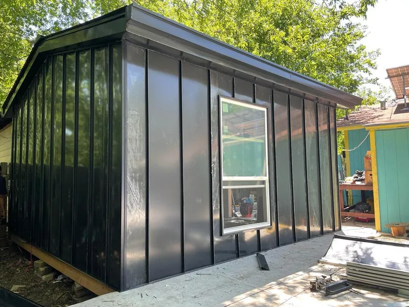 Black standing seam metal wall panels for Roof Inspection in North Bergen