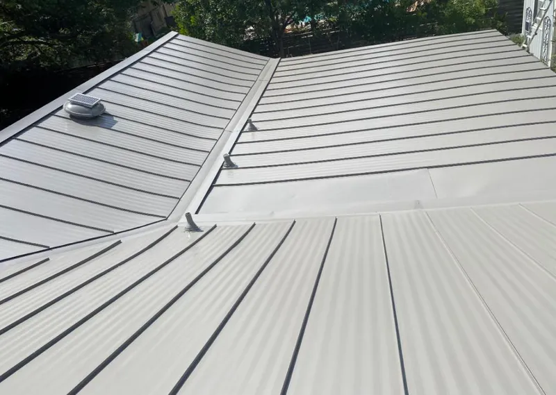 Solar attic fan installed on a metal roof for Roof Ventilation in North Bergen